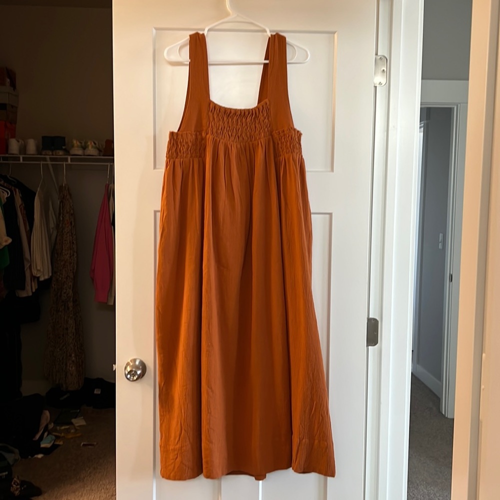 Rust colored free people dress size small and never worn